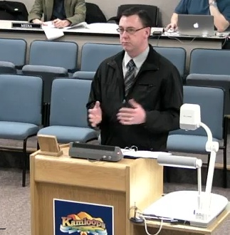 Jon Wilson of City's bylaws department presents parking-meter report at today's council meeting.