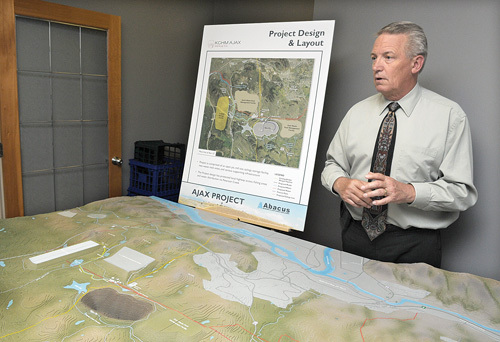 Norm Thompson with scale model of Ajax project.