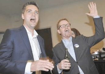 Todd Stone and Terry Lake in celebration mode Tuesday night. (Daily News photo)