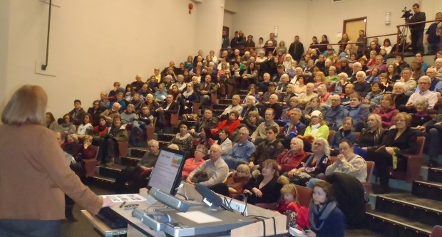 Dr. Jill Calder speaks to overflow crowd at TRU Clocktower Theatre on Ajax today.