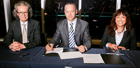 TRU president Alan Shaver, IUN CEO Christian Werner, and Baihua Chadwick of TRU World sign agreement. (TRU photo)