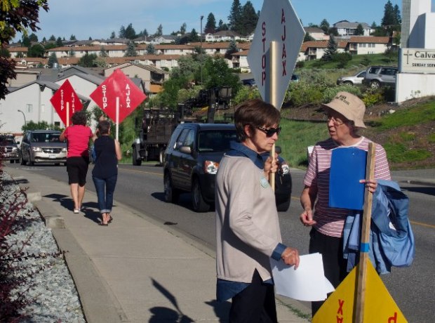 Members of Kamloops Area Preservation Society protest outside Ajax open house Tuesday.