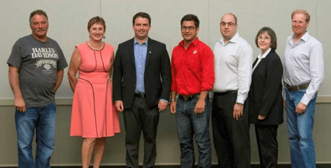 From left, Ken Dueck, Bev Wassen-Hunter, Matt McCurrach, Ryan Kurzac,  Mario Piroddi, Marlene Anderson and Jason Gagnon.  Missing from photo are Curtis Schlosser, Tom Caine and Brian Hayashi.