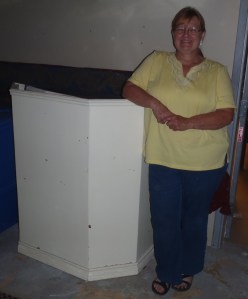 Heritage society's Mel Formanski with Phil's pulpit.