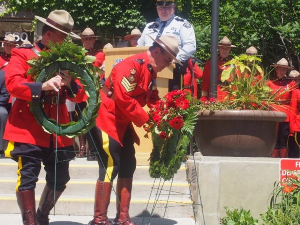 Officers place wreaths at ceremony. (Mike Youds photos)