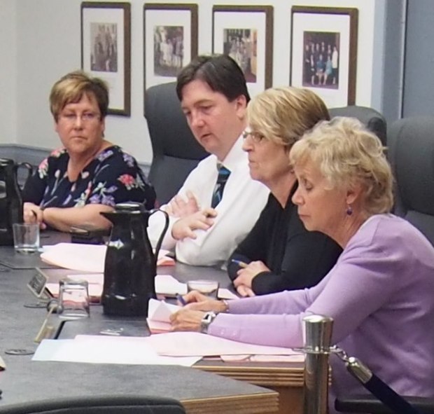 Trustees (from left) Megan Wade, Gerald Watson, Annette Glover and Joan Glover  discussing Stuart Wood.