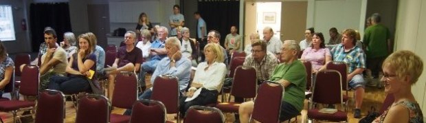 Coun. Tina Lange (right) listens at Stuart Wood meeting Wednesday night.