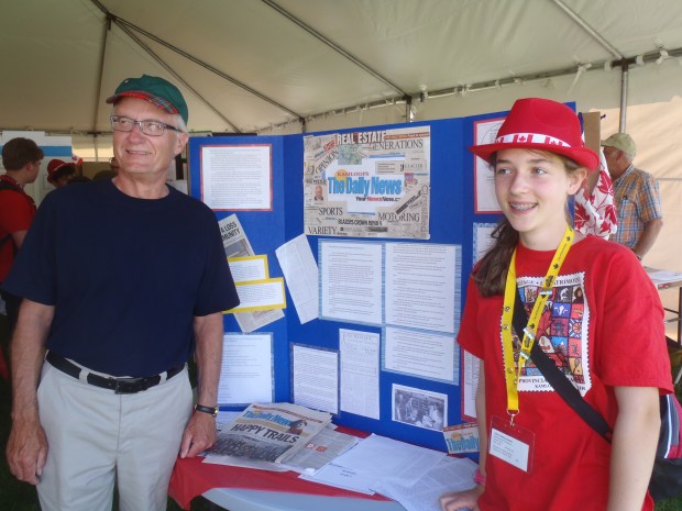 Heritage Fair finalist Julia Fabbro-Smith with her exhibit and Armchair Mayor Mel Rothenburger, whom she interviewed in putting together her history of The Kamloops Daily News.