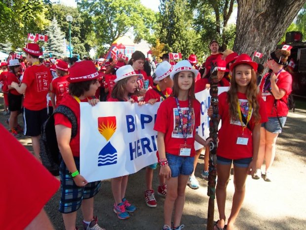 Heritage Fair kids lined up for parade onto the grounds.