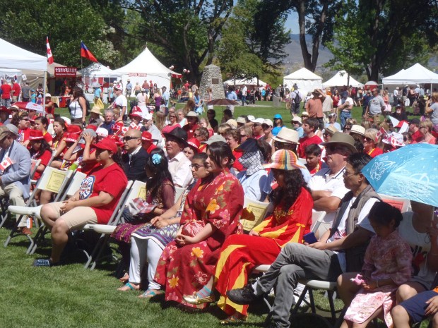 Colourfully dressed audience for opening ceremonies.