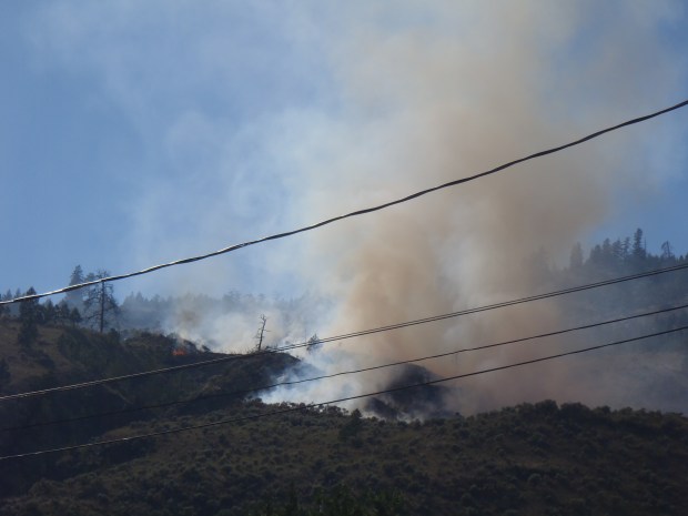 Brush fire above Westsyde sent smoke and flames into air Friday afternoon.