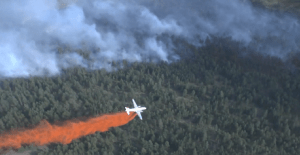 Air tanker drops retardant on Smith Creek fire.  (Screenshot BCGovFireInfo video)