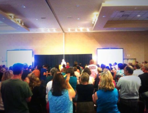 Teachers applaud BCTF president Jim Iker. (BCTF Twitter)