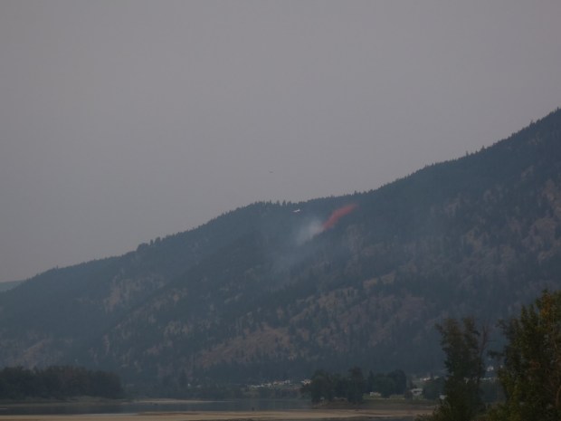 Retardant was dropped on fire across river from Whispering Pines.