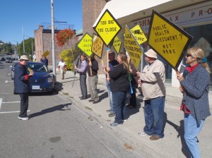 Anne Neave leads chant at anti-Ajax protest.