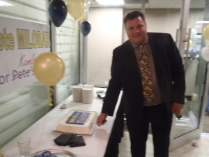 Mayor Peter Milobar takes the cake Saturday night at victory bash.