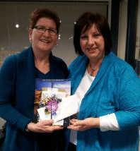 Alice Pearson (left) presented with her win by Judy Basso.