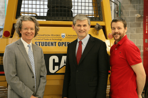 TRU president Alan Shaver, Advanced Education Minister Andrew Wilkinson, and second-year plumbing student Mark Hunter.