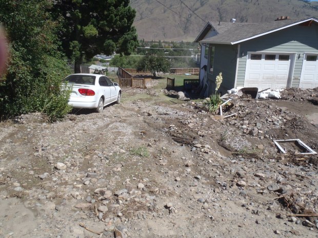 Flash flood swept debris through this yard on Parkview Drive, onto Westsyde Road and into Oak Hills.