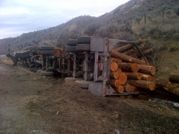 Logging truck accident causes on Paul Lake Road.