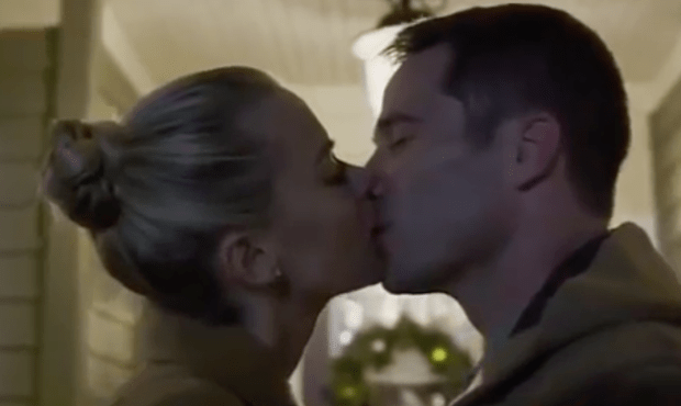 The first kiss always happens Christmas eve in sappy holiday movies. This one is from The Mistletoe Promise.