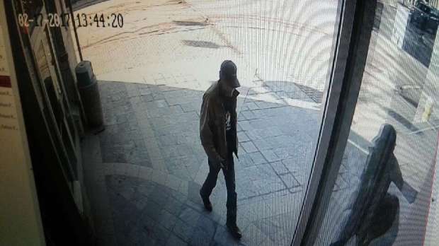 Surveillance camera photo of suspect at bank.